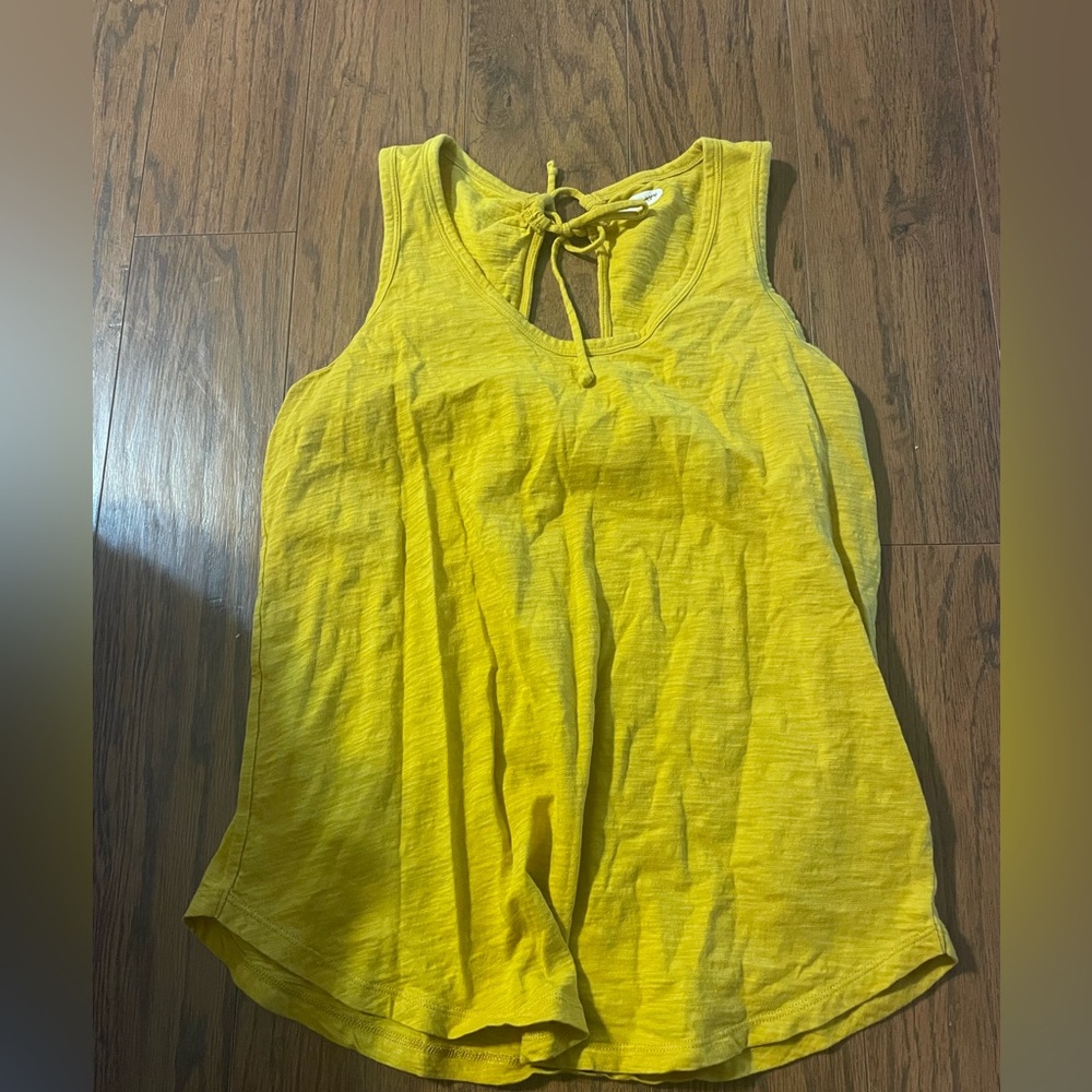 Yellow Sleeveless Top This top is more of a mustard yellow.